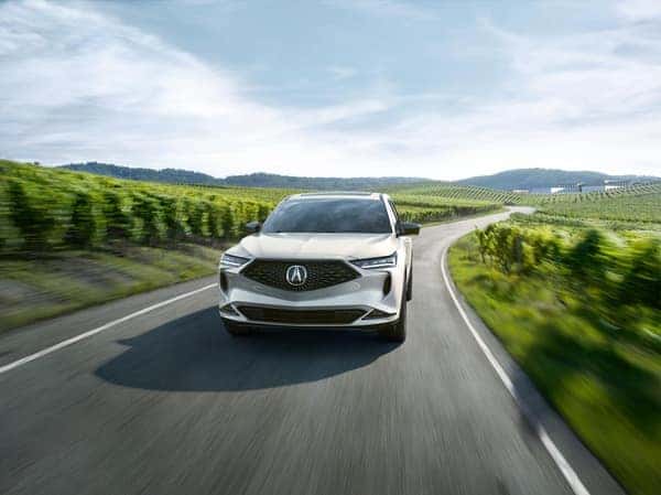 Acura MDX driving on the road