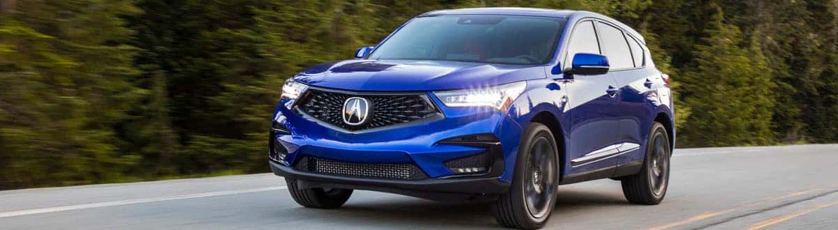 Blue Acura RDX Luxury SUV Driving