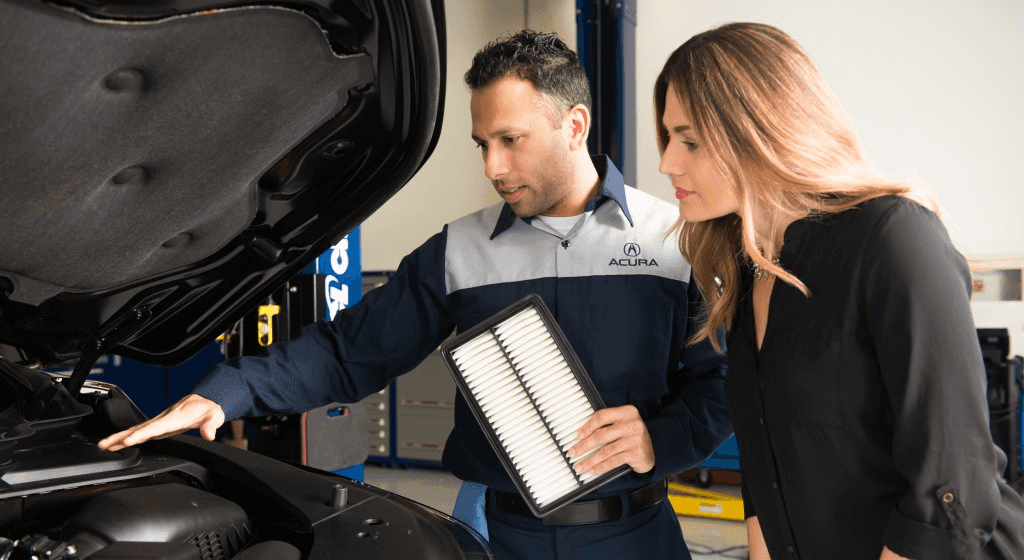 Technician discussing inside hood