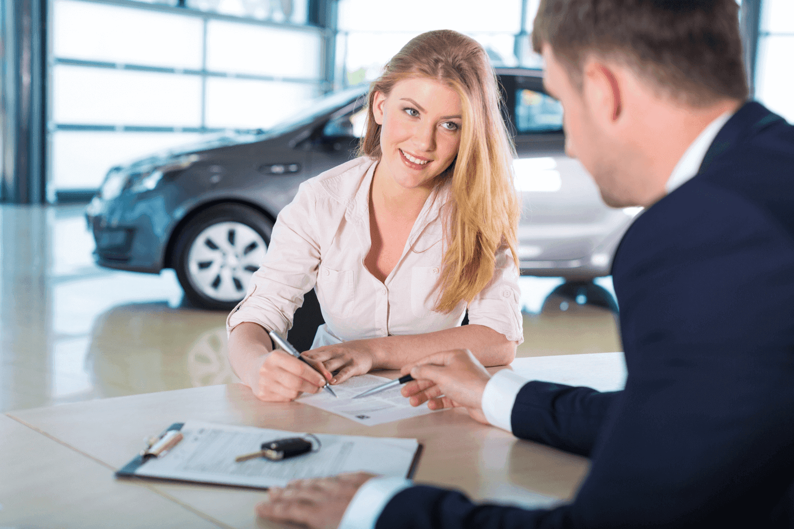 Finance expert and woman looking at paperwork