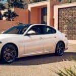 Alfa Romeo Giulia Parked in Front of House