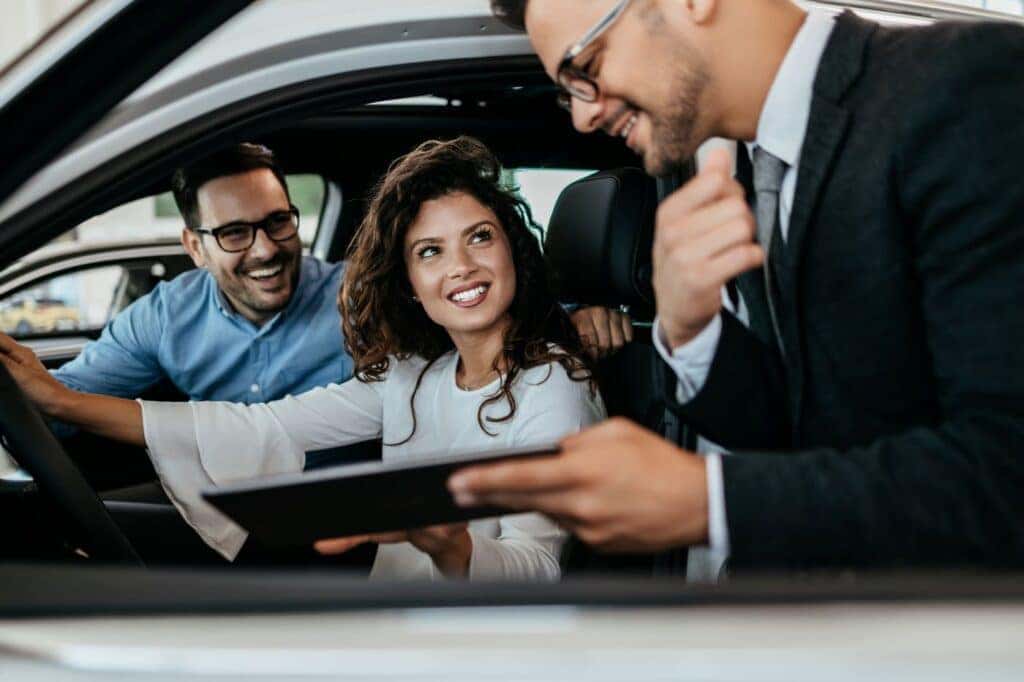 Happy Couple Choosing a New BMW near Bronx NY