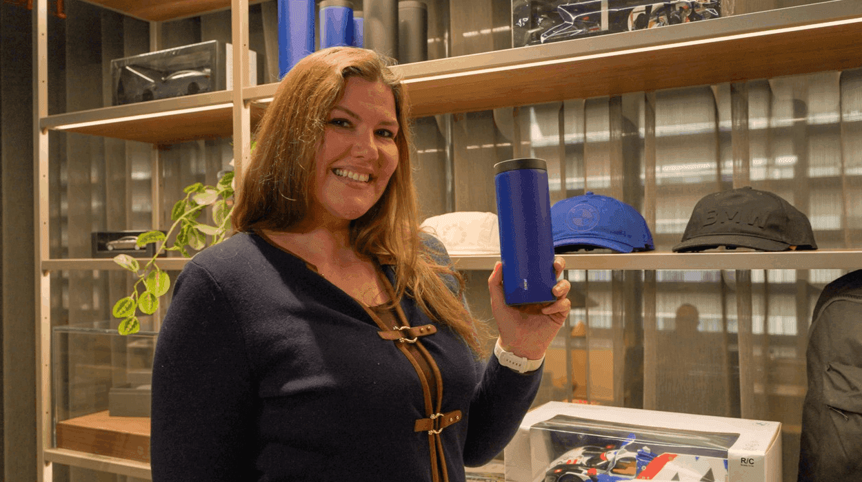 Shopper smiling at camera in boutique