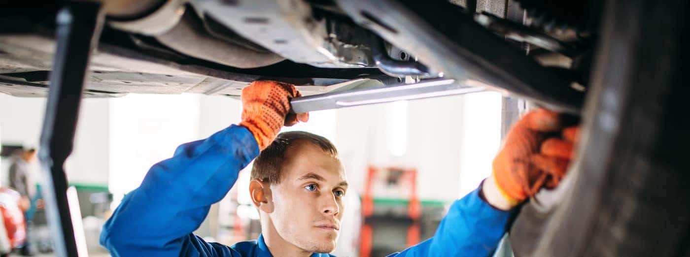 mechanic working on suspension repair