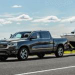 Gray Ram 1500 towing a boat