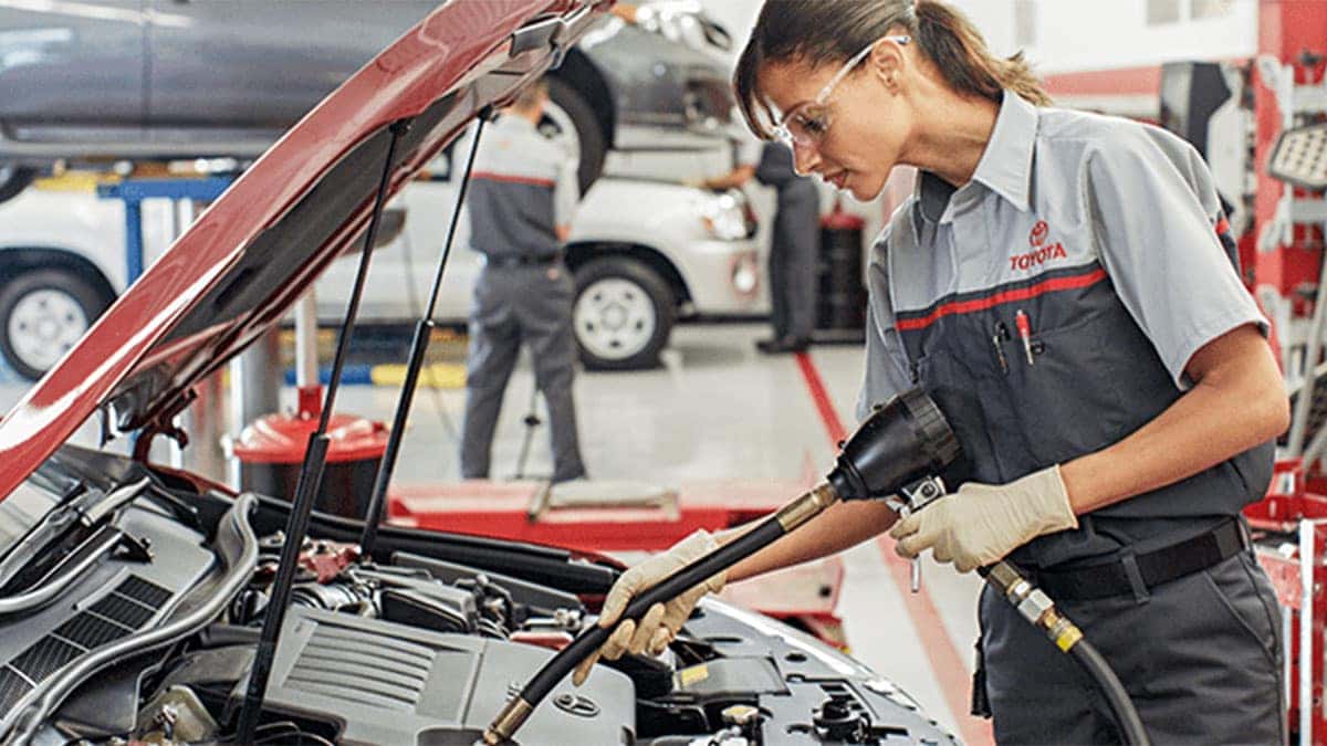 Toyota service tech servicing a Toyota