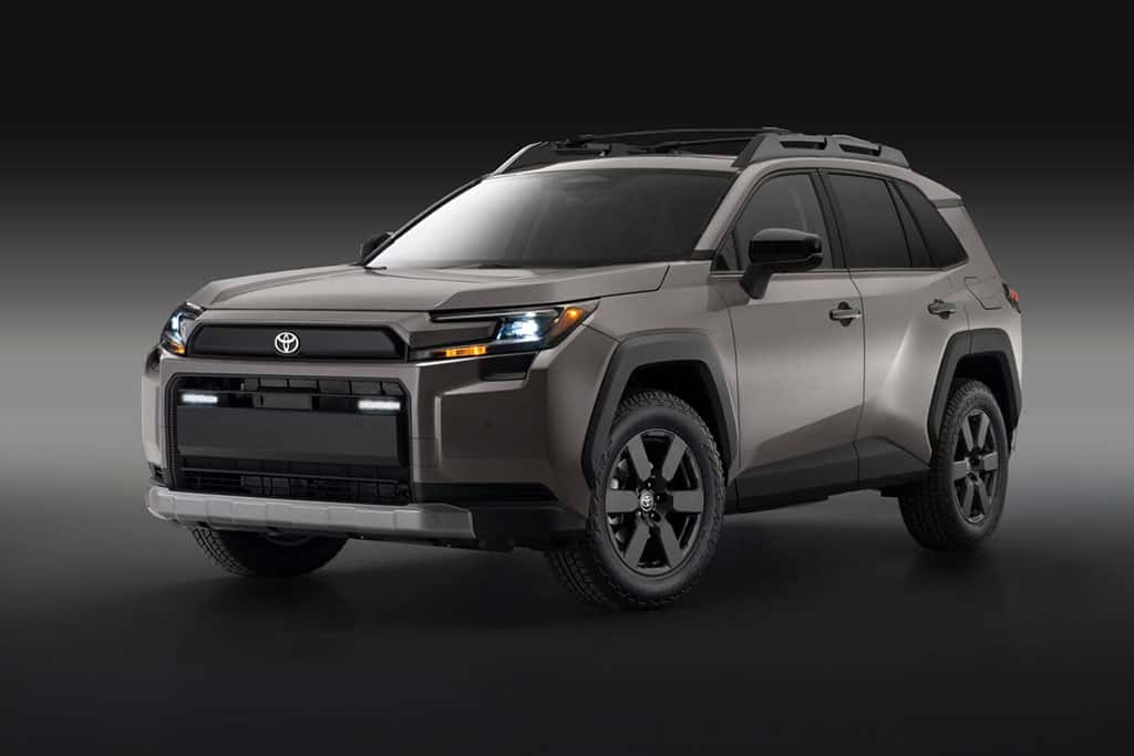 2026 Toyota RAV4 Woodland in Urban Rock color with headlights on