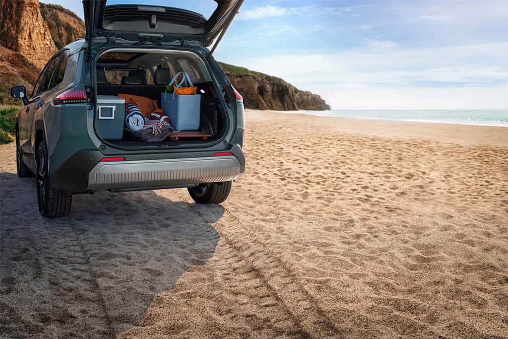 2026 Toyota RAV4 Limited parked at a beach showing cargo space with trunk open