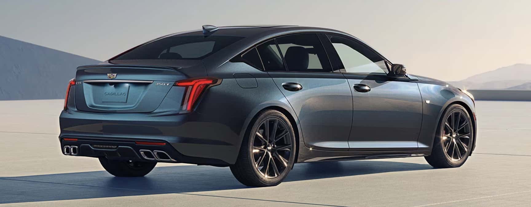 New 2026 Cadillac CT5-V back side view For Sale in Austin hill country landscape