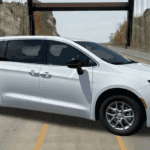 2026 Chrysler Voyager LX parked in front of Covert CDJR Bee Cave showroom in Austin, Texas