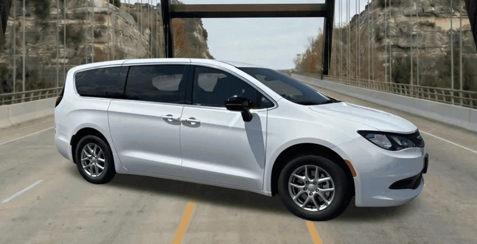 2026 Chrysler Voyager LX parked in front of Covert CDJR Bee Cave showroom in Austin, Texas
