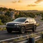 2026 Jeep Cherokee driving on an Auatin TX road in the Hill Country
