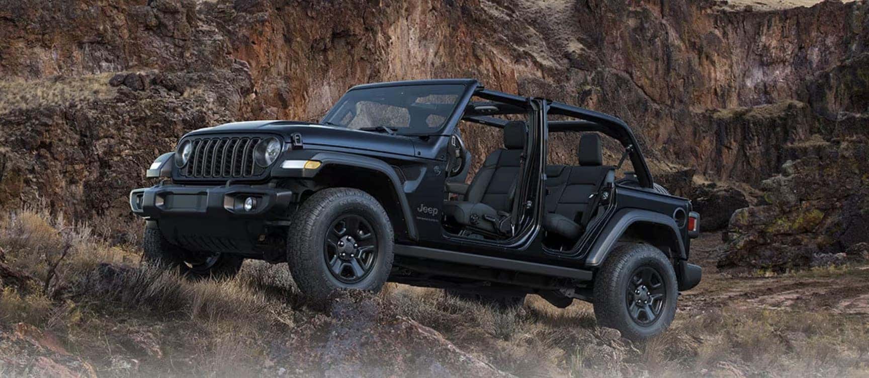 2026 Jeep Wrangler Rubicon climbing rocks in Central Texas near Fredericksburg