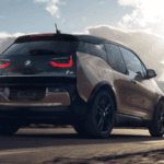 2020 bmw i3 brown exterior driving down deserted road