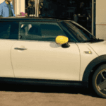 2021 mini cooper electric white exterior parked outside on curb charging