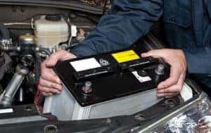Technician installing a battery