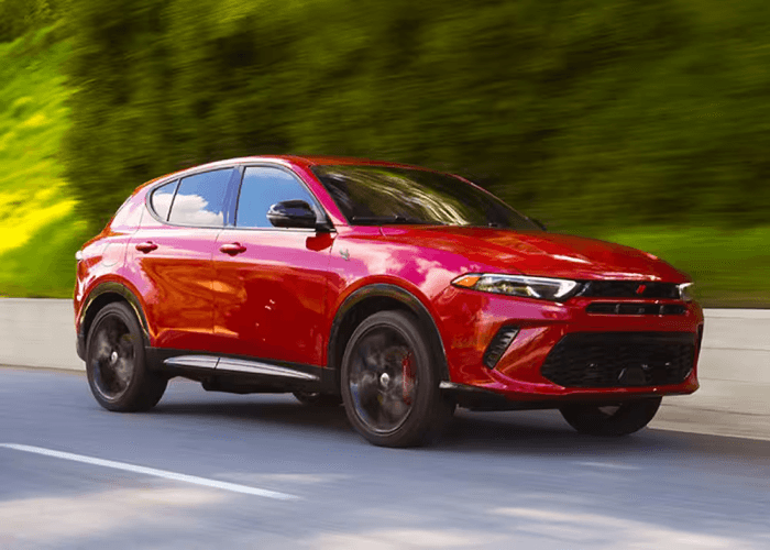 Red Dodge Hornet hybrid driving