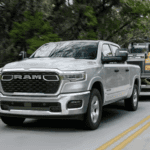 Silver Used Ram 1500 towing a trailer