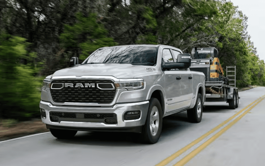 Silver Used Ram 1500 towing a trailer