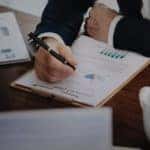 Finance Gy with a tablet of paper