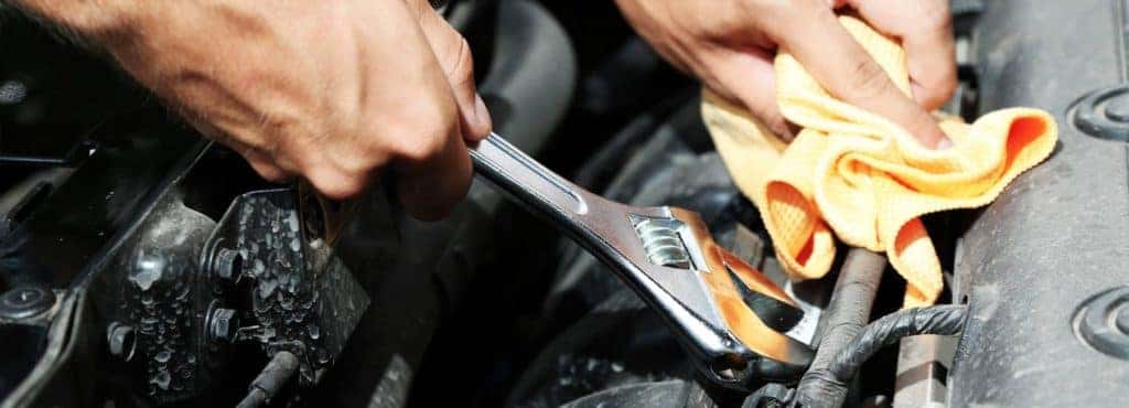 Service tech working on car