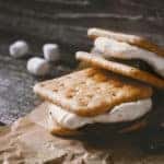 Smores on the parchment on the wooden table