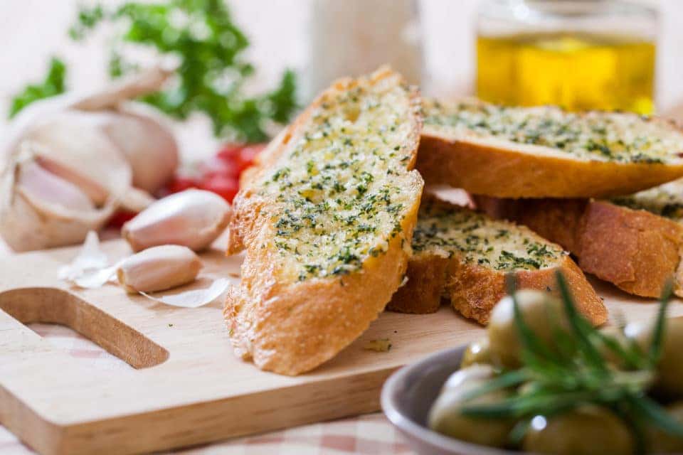 Garlic bread on cutting board