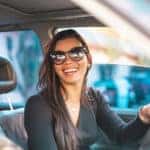 Woman driving with sunglasses on