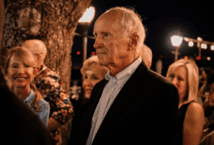 A surprised Bob Firkins hears he is the LECOM Leadership Award recipient