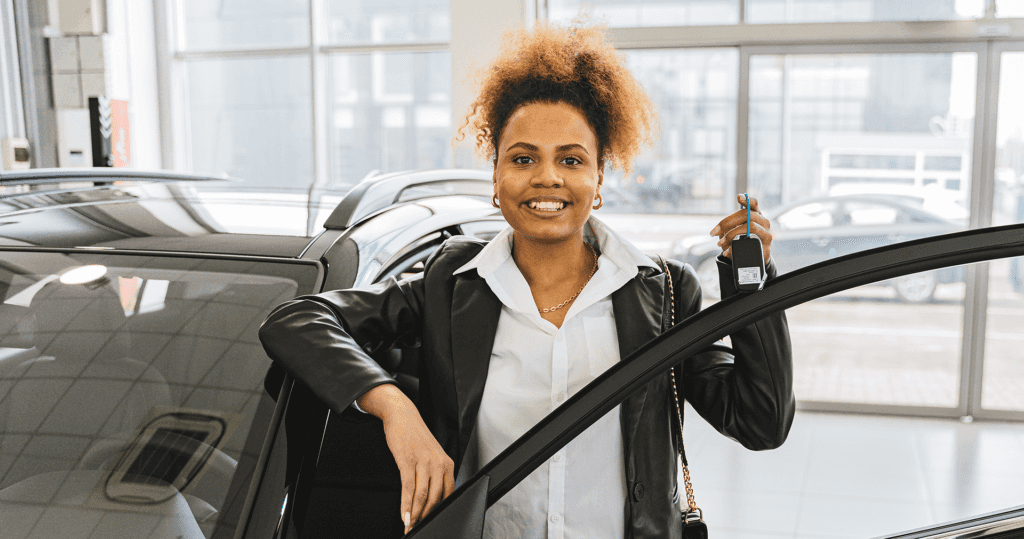 Happy Car buyer holding her keys