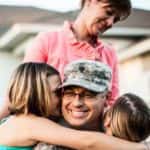 Kids hugging dad