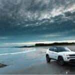 White Jeep Compass on beach