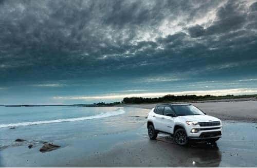 White Jeep Compass on beach