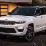White Jeep Grand Cherokee parked in street