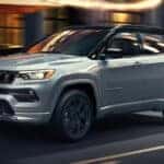 Silver Jeep Compass driving on the road