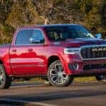 Red Ram 1500 parked on road