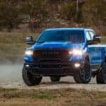 Blue Ram 1500 parked on rocks