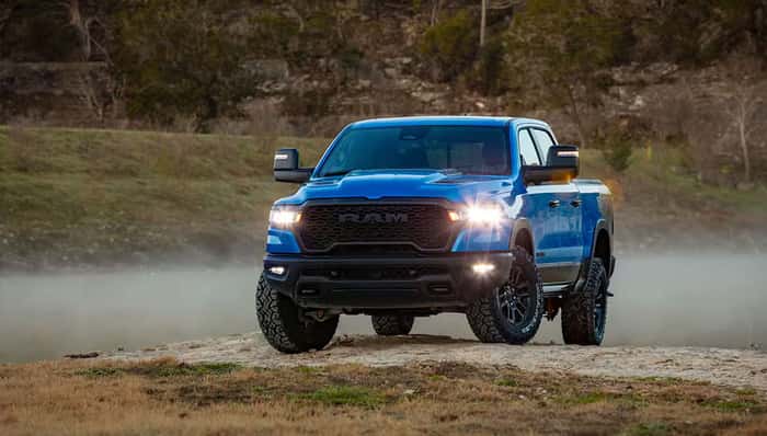 2025 Ram 1500 TRX in Hydro Blue parked off-road near Bradenton, Florida