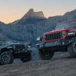 2 Jeep Wranglers parked on the rocks