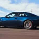 Blue 2025 Dodge Charger driving on the road