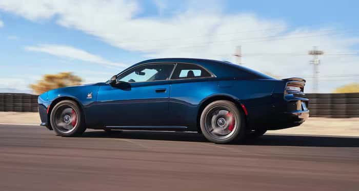 Blue 2025 Dodge Charger driving on the road
