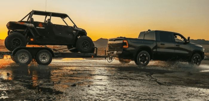 2026 Ram 1500 towing a vehicle