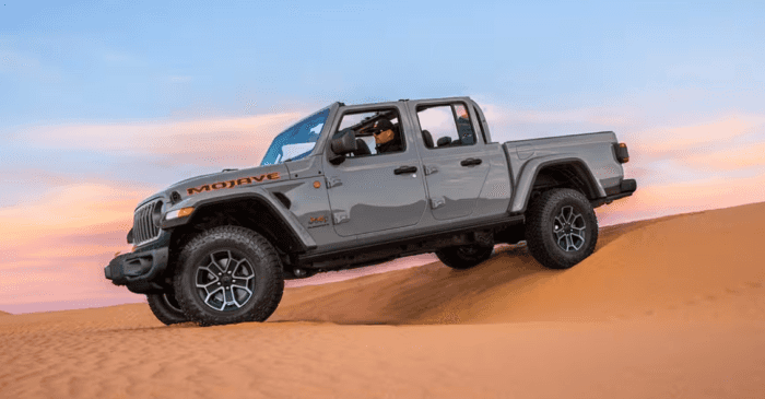 Gray 2025 Jeep Gladiator Mojave driving in dunes