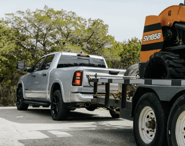 Gray 2026 Ram 1500 towing a trailer