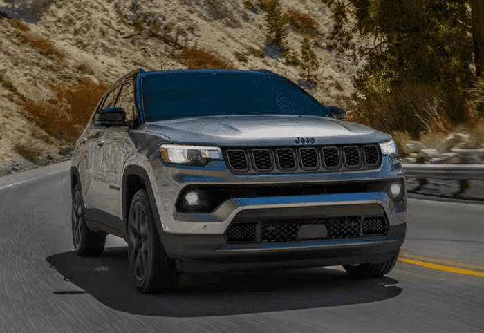 Gray 2026 Jeep Compass driving on road