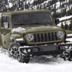 Green 2026 Jeep Gladiator Rubicon driving in the snow