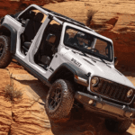 Silver 2026 Jeep Wrangler Willy's driving off-road