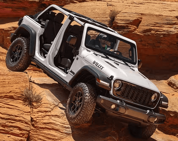 Silver 2026 Jeep Wrangler Willy's driving off-road