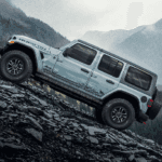 Gray 2026 Jeep Wrangler Rubicon driving off-road