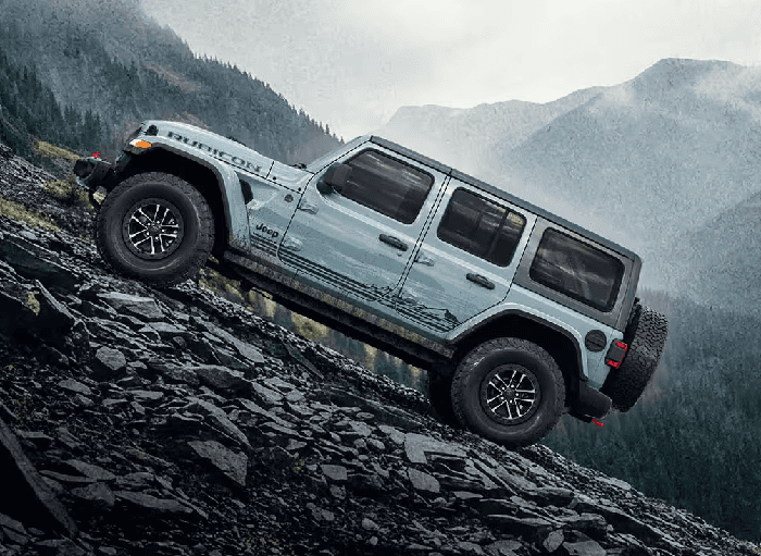 Gray 2026 Jeep Wrangler Rubicon driving off-road